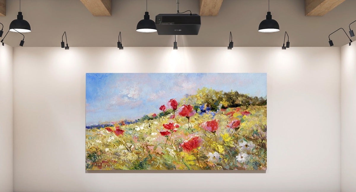 LG ProBeam projector on the ceiling projecting a painting onto a gallery wall