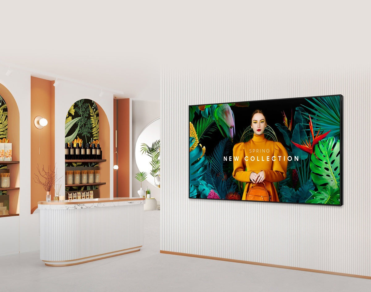 Samsung QBC signage display showing a fashion promotion on the wall of a boutique