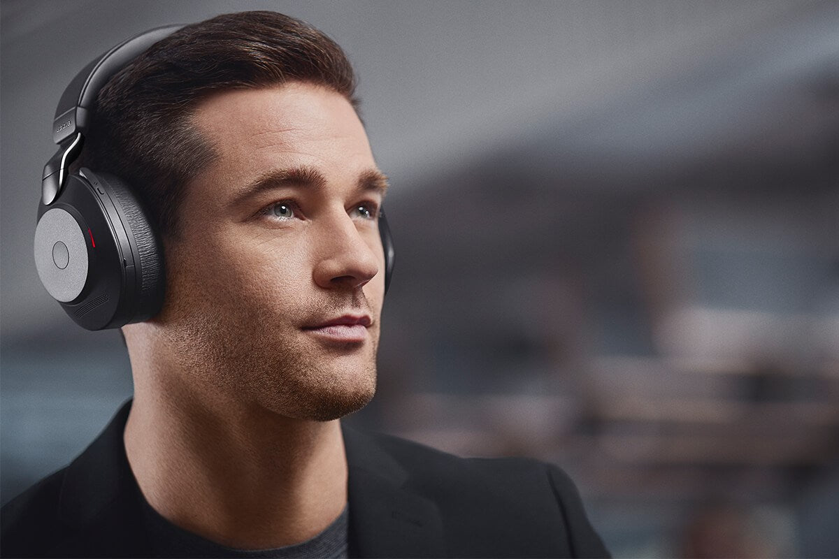 Man wearing a Jabra Evolve2 85 over-ear headset in an office