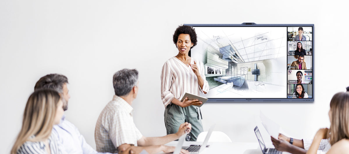 Presenter at a MAXHUB XBoard V7 display with remote participants on screen