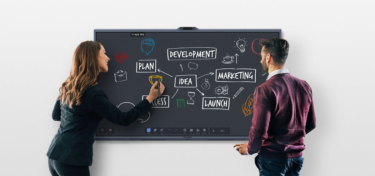 Two people writing on a MAXHUB XBoard V7 whiteboard