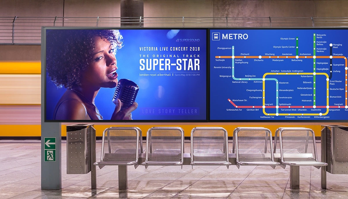 Samsung signage displays showing a concert poster and a metro map on a station platform