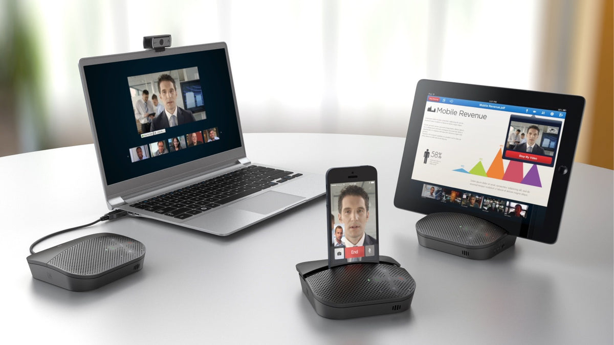 Logitech P710e speakerphones used with a laptop, a phone and a tablet